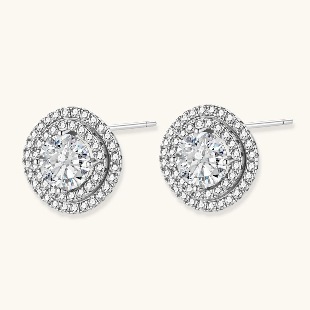 Double halo sterling silver stud earrings with brilliant round moissanite center stones and pavé crystal accents