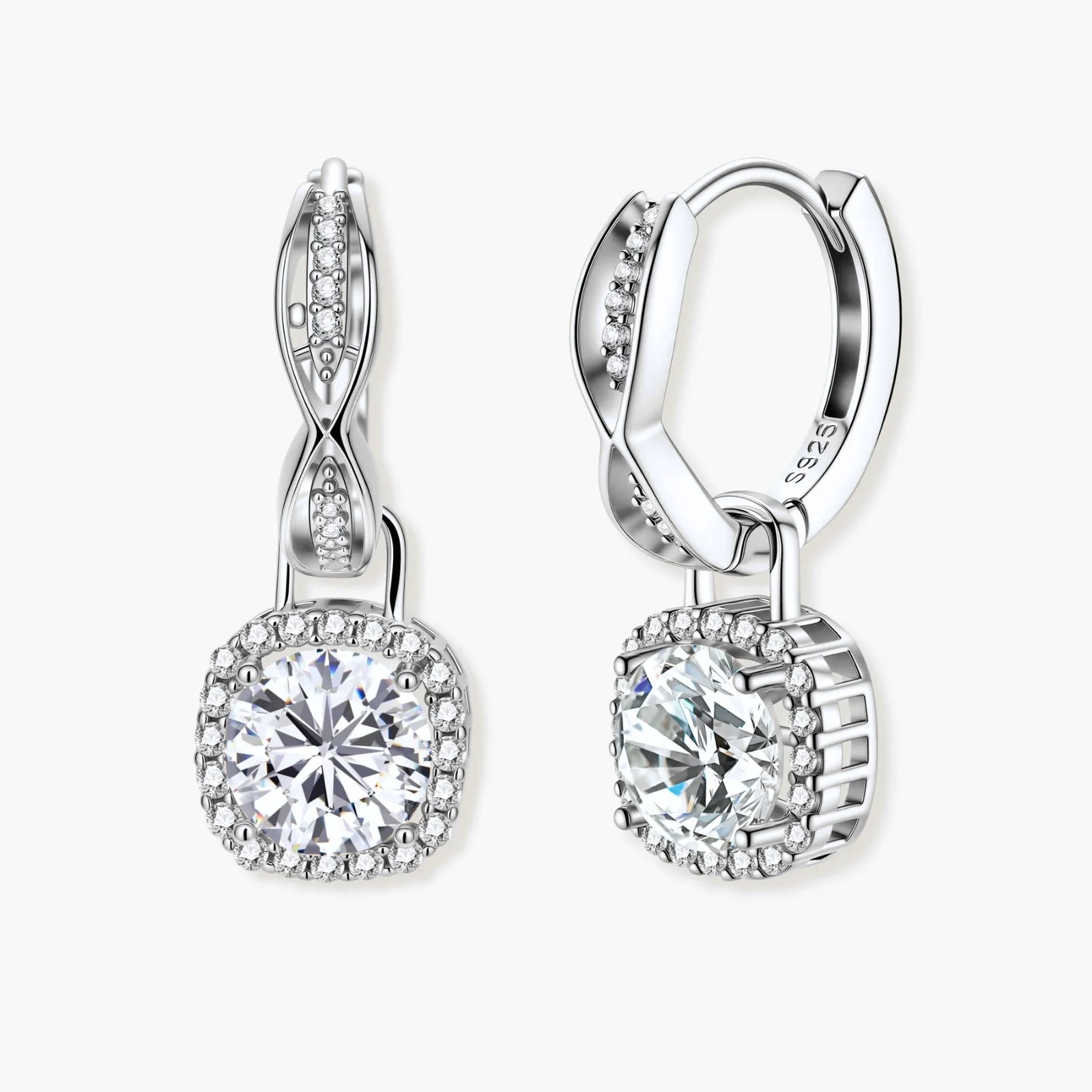 Sterling silver twisted hoop earrings with round moissanite stones in halo settings against neutral background.