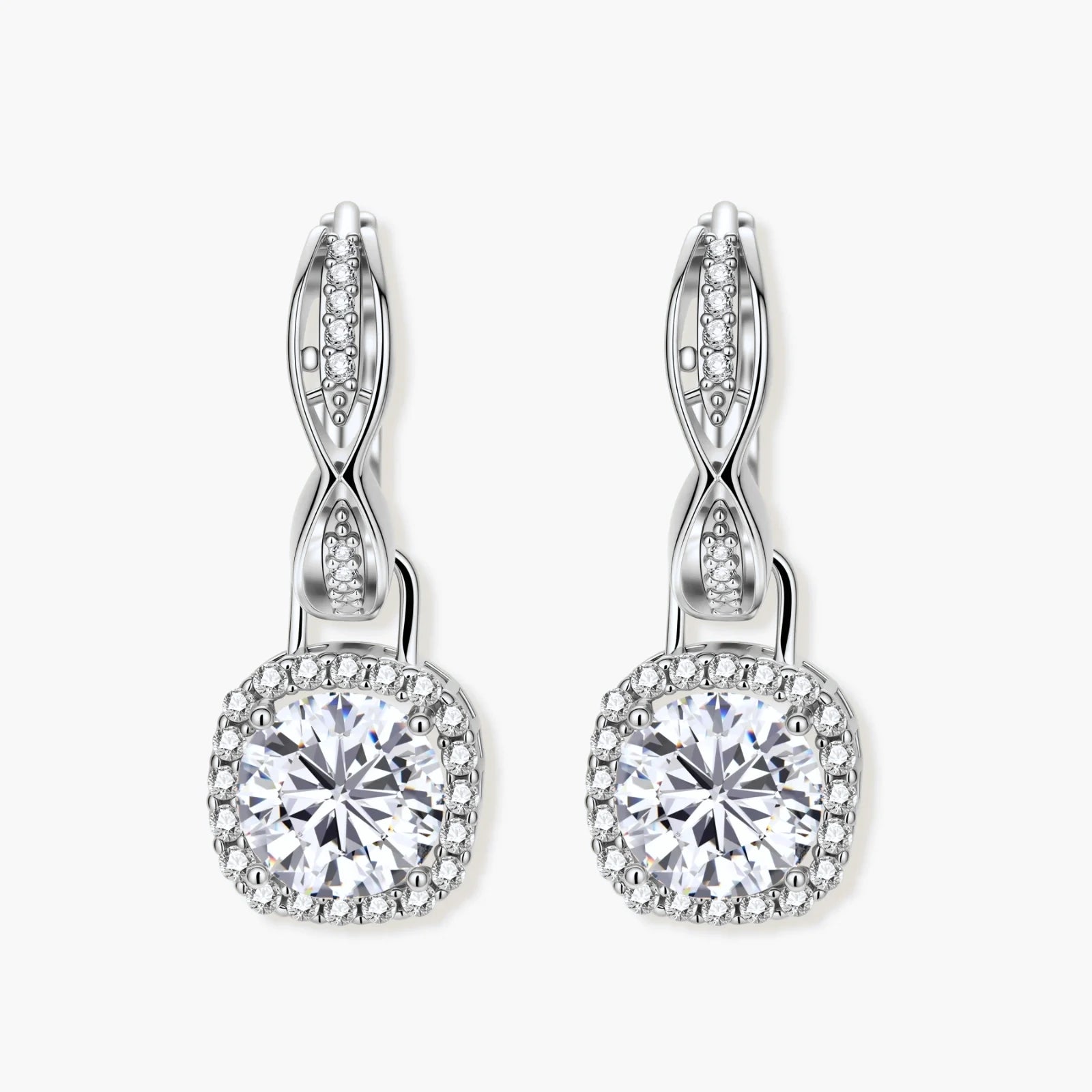 Sterling silver twisted hoop earrings with round moissanite stones in halo settings against neutral background.