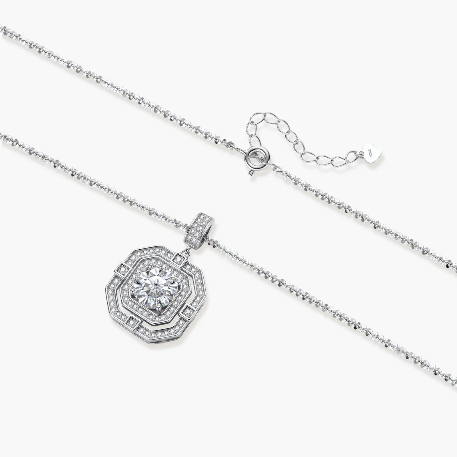 Sterling silver octagonal pendant necklace with brilliant moissanite center stone and halo setting on white background.