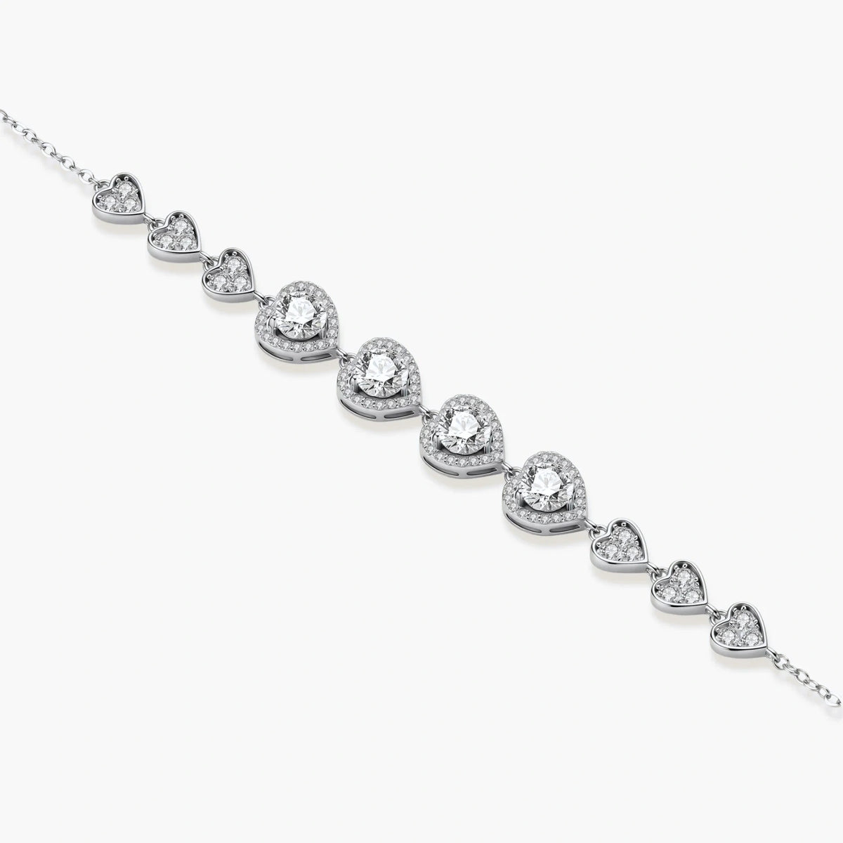 Sterling silver bracelet with graduated heart-shaped links and sparkling moissanite stones in VVS1 clarity on white background.