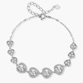 Sterling silver bracelet with graduated heart-shaped links and sparkling moissanite stones in VVS1 clarity on white background.