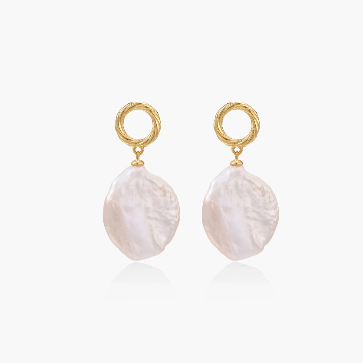 18K gold vermeil twisted circle studs with organic white baroque pearl drops on cream background