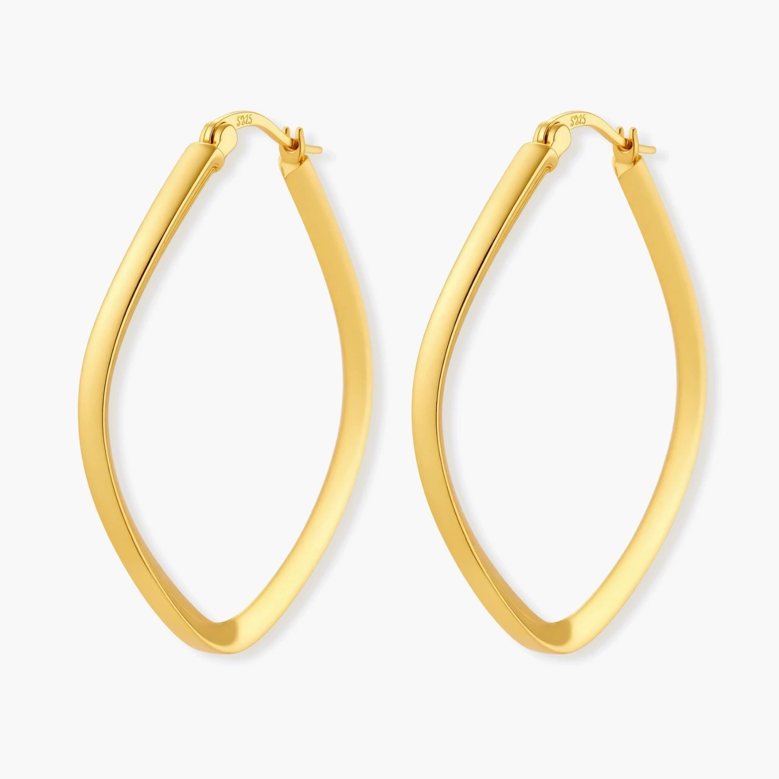 Set of geometric gold-plated sterling silver hoop earrings in oval and cushion shapes on cream background