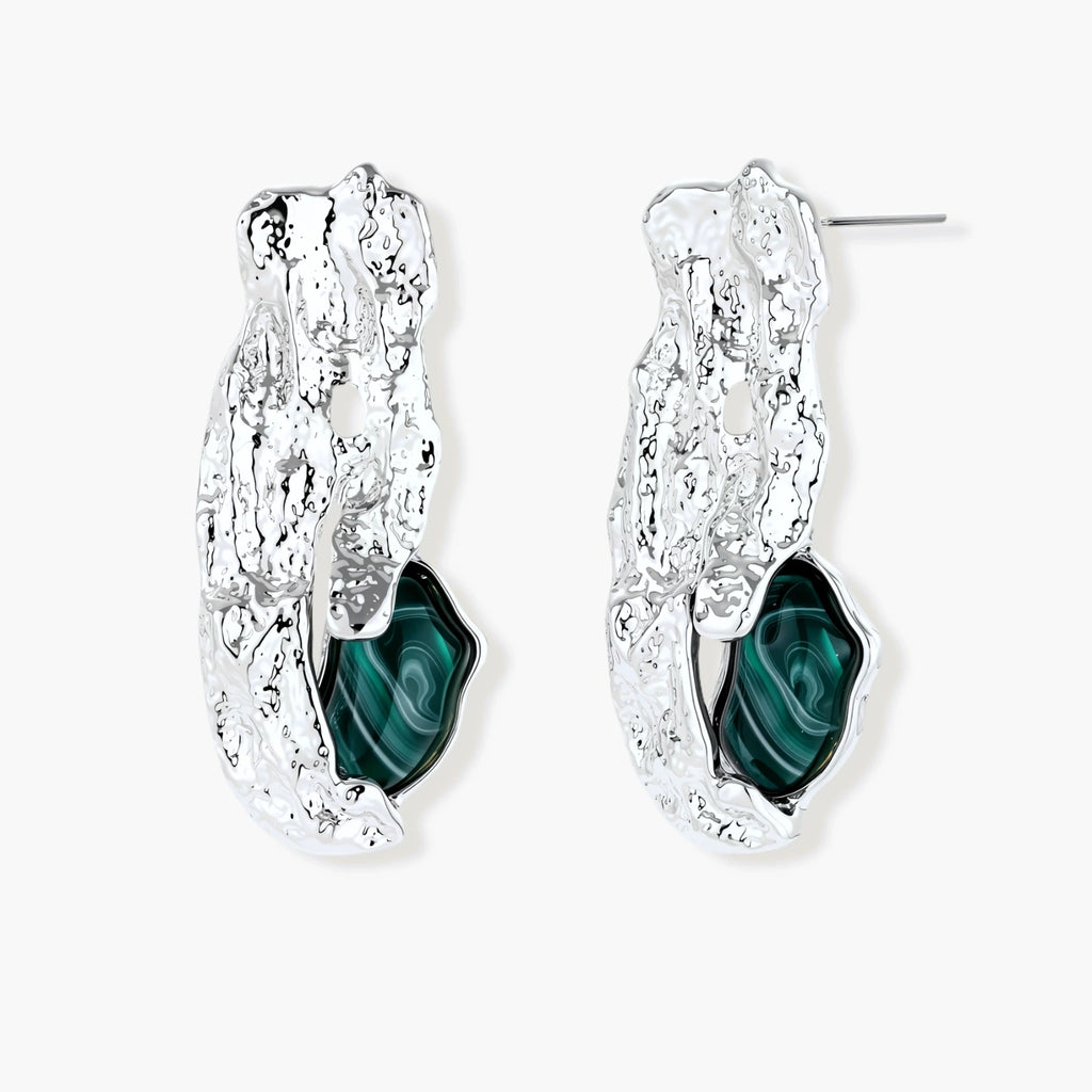 Organic-shaped stud earrings with hammered silver finish and green malachite-pattern resin stones on white background.