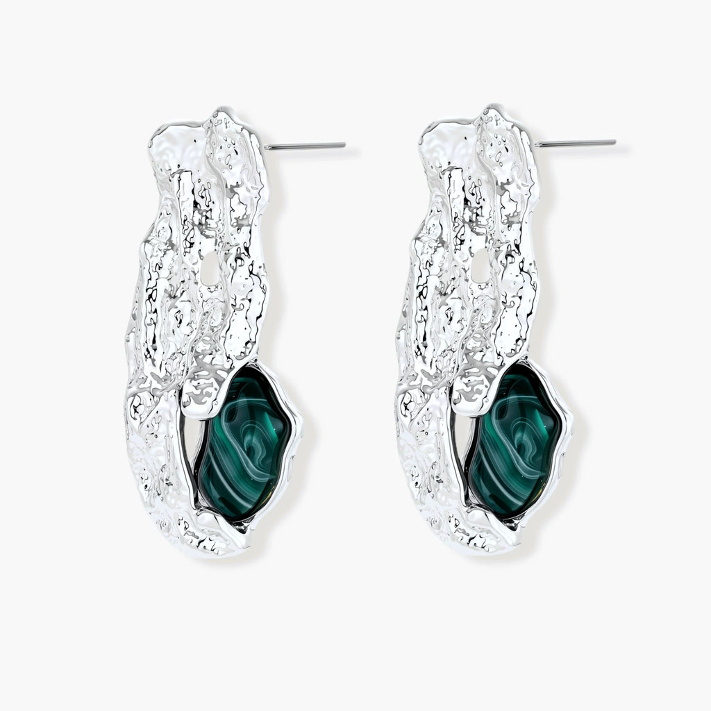 Organic-shaped stud earrings with hammered silver finish and green malachite-pattern resin stones on white background.