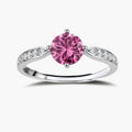 Brilliant pink moissanite ring in sterling silver 4-prong setting with accent stones on adjustable band