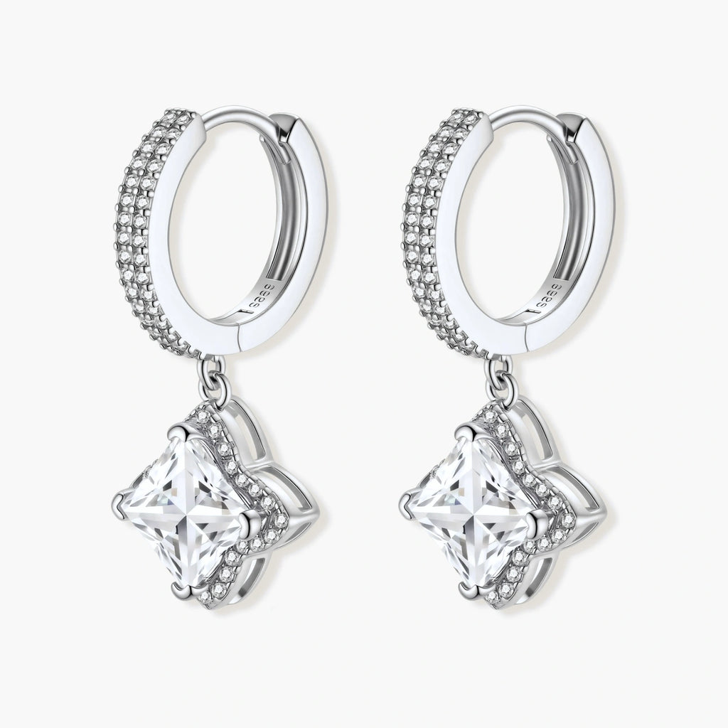 Sterling silver huggie hoops with geometric diamond-shaped moissanite dangles featuring pavé crystal details