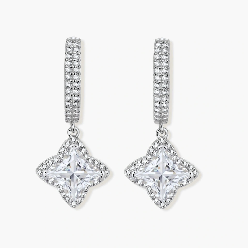 Sterling silver huggie hoops with geometric diamond-shaped moissanite dangles featuring pavé crystal details