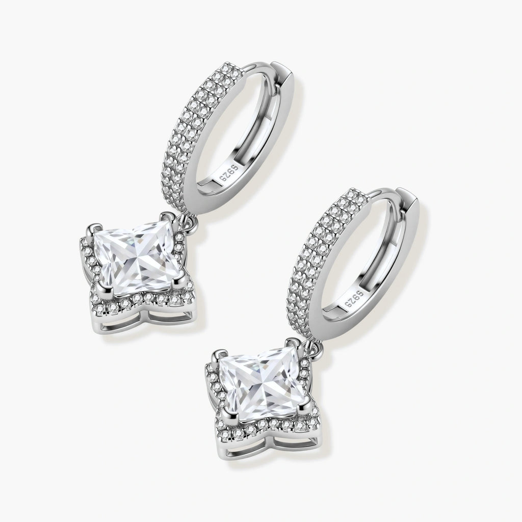 Sterling silver huggie hoops with geometric diamond-shaped moissanite dangles featuring pavé crystal details