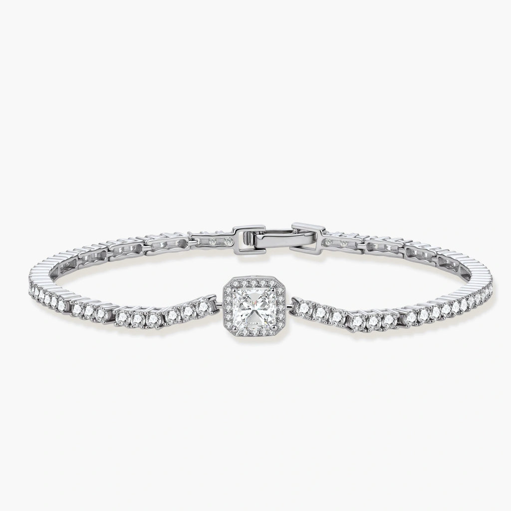 Sterling silver tennis bracelet with cushion-cut moissanite centerpiece surrounded by smaller stones in continuous setting