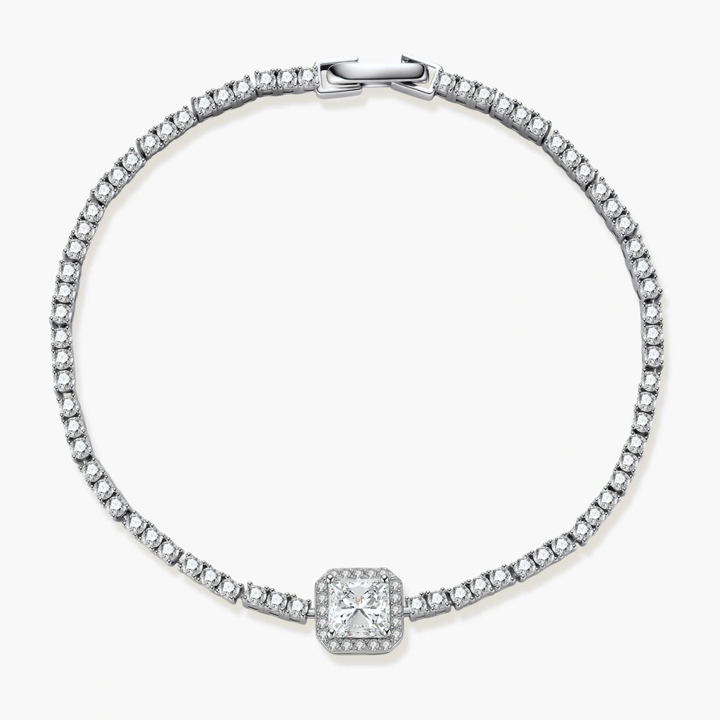 Sterling silver tennis bracelet with cushion-cut moissanite centerpiece surrounded by smaller stones in continuous setting