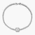 Sterling silver tennis bracelet with cushion-cut moissanite centerpiece surrounded by smaller stones in continuous setting