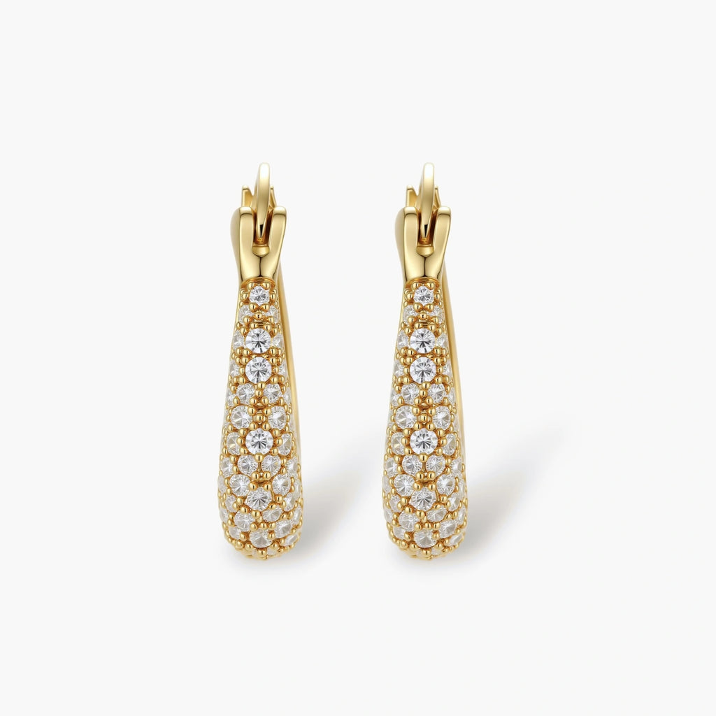 Gold-plated hoop earrings fully covered in sparkling zircon crystals with hinged closure on neutral background
