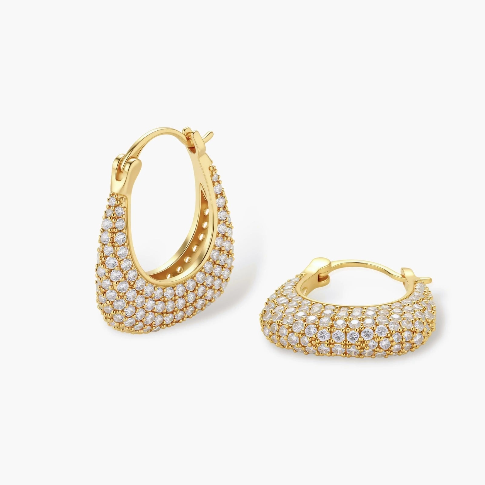 Gold-plated hoop earrings fully covered in sparkling zircon crystals with hinged closure on neutral background